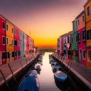 Colorful canal-side buildings at sunset